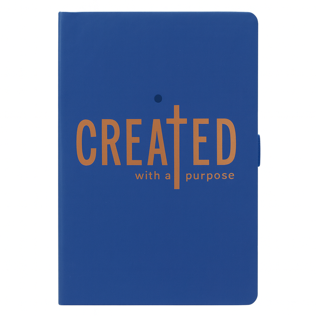 Blue notebook with 'CREATED with a purpose' text on a white background