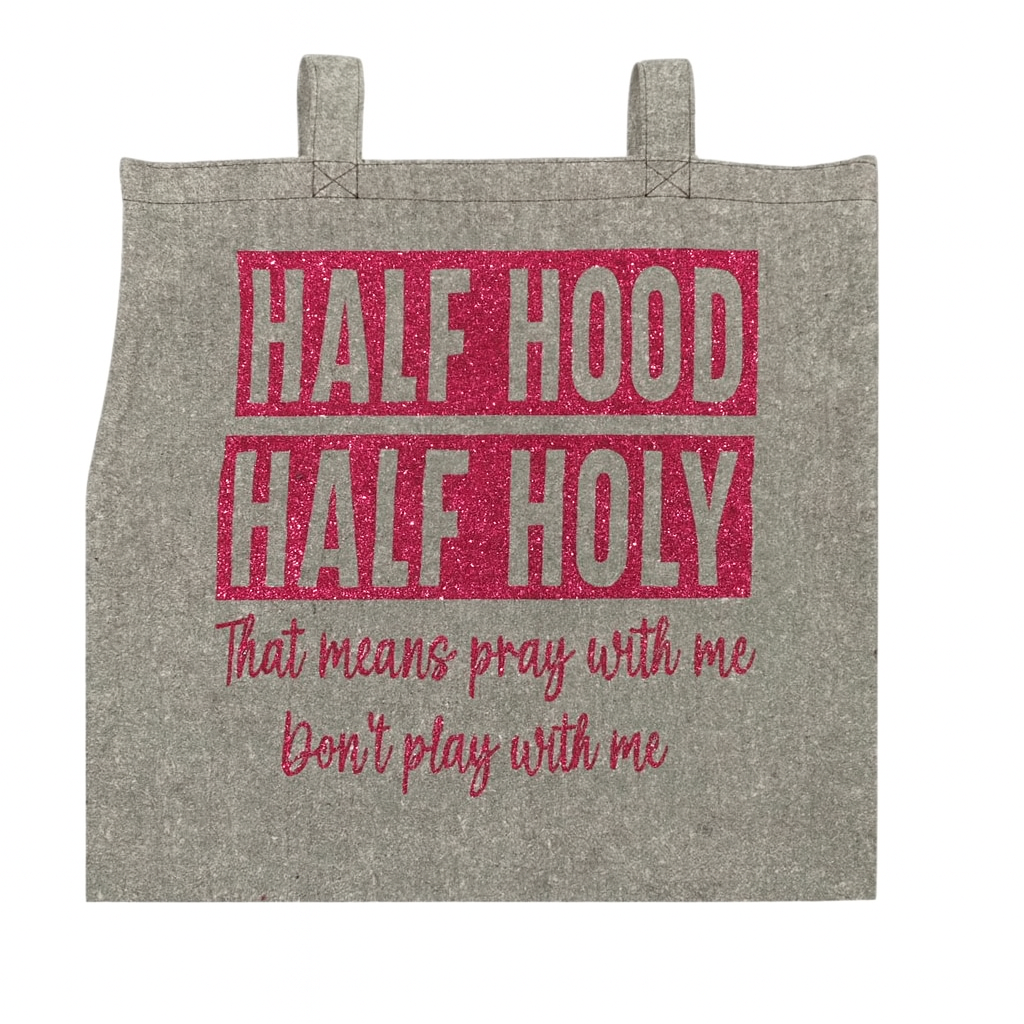 Gray bag with red text 'HALF HOOD HALF HOLY' and additional text on a white background