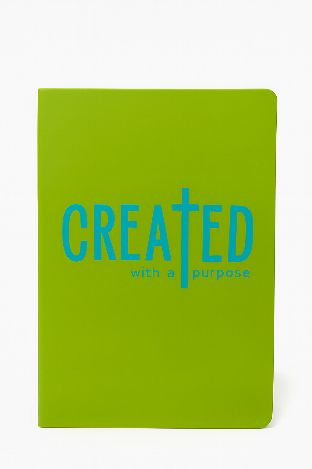 Green notebook with 'CREATED with a purpose' text on a white background