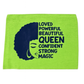 Green towel with black silhouette of a woman and empowering text on a white background