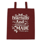 Maroon tote bag with white text 'Fearfully And Wonderfully Made Psalm 139:14' on a white background