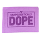 Purple towel with 'Unapologetically Dope' text on a white background