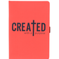 Red notebook with 'CREATED with a purpose' text on a white background