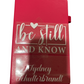 Red notebook with 'be still and know' text on a white background