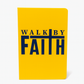 Yellow notebook with 'Walk by Faith' text on a white background