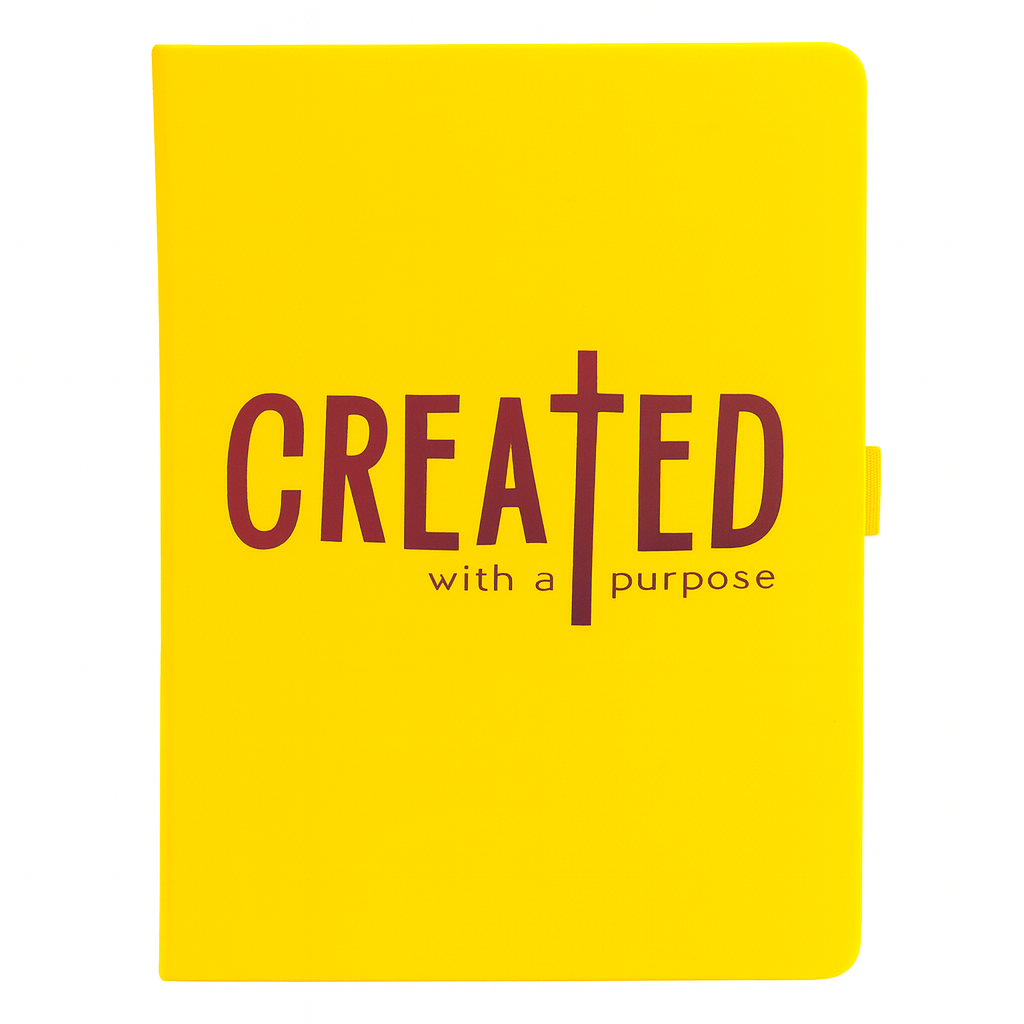 Yellow notebook with 'CREATED with a purpose' text on a white background
